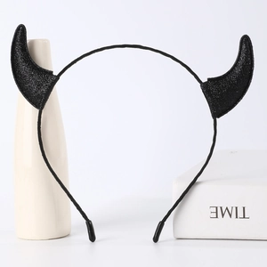 Detailed view of a black glittery devil horn headband accessory for Halloween costumes.