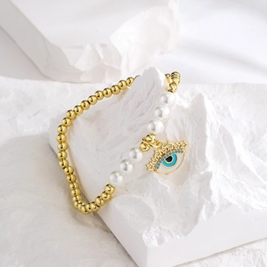 18K gold-plated beaded bracelet with white pearls and blue evil eye star pendant