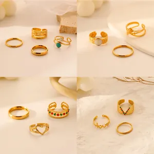 Detailed view of luxury gold titanium steel ring sets featuring stars, moons, and hearts