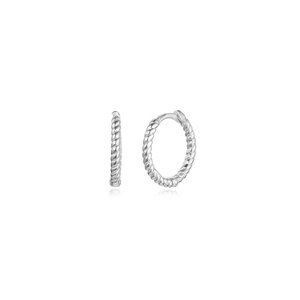 Close-up of twisted rope texture silver hoop earrings with a polished metallic finish