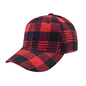 Detail of red and black buffalo plaid fabric and curved brim on the baseball cap