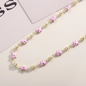 Pink evil eye butterfly necklace with gold chain and colorful enamel star pendants