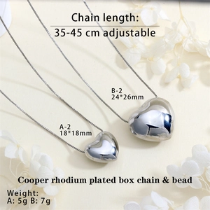 Detail of copper rhodium plated heart necklaces with adjustable box chain in two sizes