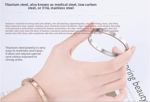 Detail of 316L stainless steel bangle with engraved circles and inset crystals