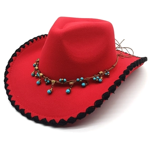 Red western felt hat with black knit trim and turquoise beaded ethnic stone decoration