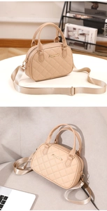 Detail of beige quilted shoulder bag featuring gold hardware and wide woven strap