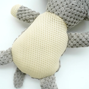 Detailed close-up of grey corduroy and beige breathable mesh fabric on pet squeaky toy