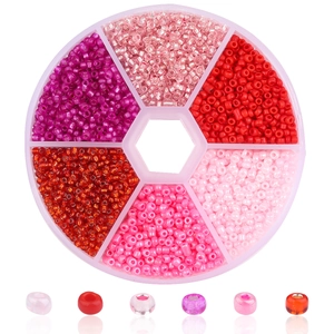Bastelset für Schmuck mit roten und rosa Glasperlen in einer sechseckigen Box