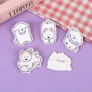 Set of five cute acrylic Bichon dog badges with safety pins on purple background
