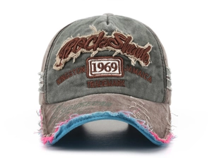 Close-up of distressed cotton baseball cap featuring vintage 1969 3D embroidery detail