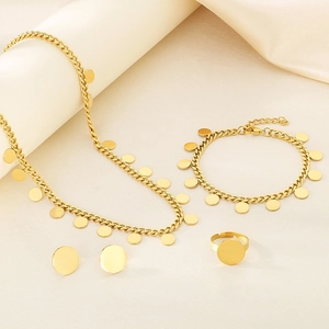 Elegant gold-tone four-piece jewelry set with round pendants on minimalist cuban chains