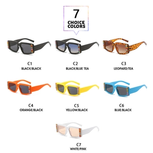 Detail view of seven colorful rhinestone-encrusted square sunglasses in various lens tints