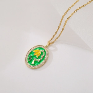 Elegant gold necklace with green and yellow floral enamel pendant and micro-set crystals