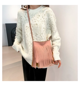 Chic pink fringe crossbody bag for women with bohemian tassel design and leather texture