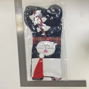 Detail of blue Christmas stocking with white cat motif and red plaid accents, 50cm size