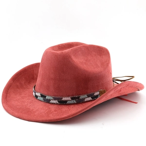 Close-up of brick red suede cowboy hat with geometric beaded band and leather tassels