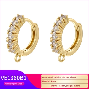 Detail view of gold-plated brass hoop earrings with crystals and size specifications