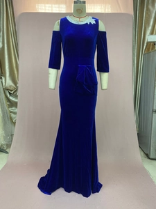 Detail of royal blue velvet dress with white lace trim neckline and off-shoulder design