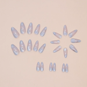 Cat eye press-on nails with purple gradient moon and star designs in long almond shape