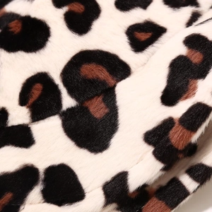 Macro shot of high-quality faux fur leopard print fabric with dense and soft texture
