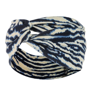 Detail of blue and beige zebra pattern fabric headband with a stylish twist knot design