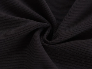 Macro shot showing high-quality black ribbed knit fabric texture and soft fabric folds