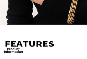 Detailed close-up of golden Cuban chain with inset zircons over a black knit sweater