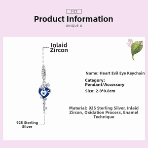 Macro view of S925 sterling silver evil eye heart key pendant with blue enamel and zircons