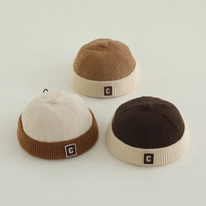 Retro corduroy docker hats for kids featuring contrast stitching and 'C' letter patch