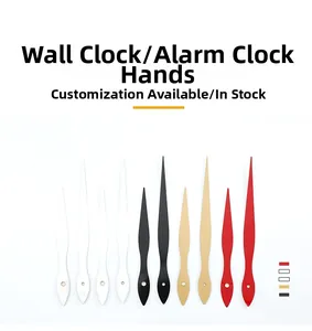 Close-up of assorted metal clock hands in red, black, gold, and white finishes
