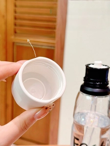 Detail view of the portable water bottle lid with dual drinking modes and a built-in straw