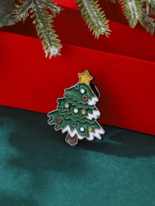 Broche sapin de Noël en émail avec perles colorées et étoile sur fond en velours vert