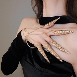 Detailed macro view of golden hollow flower claw rings with intricate connecting chains