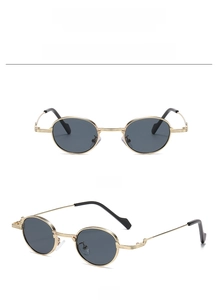 Detail view of oval metal sunglasses with gold frames and grey lenses from two angles