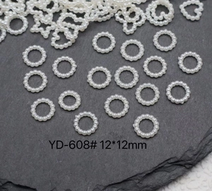 Macro shot of 12x12mm white faux pearl ring charm for DIY jewelry and accessories
