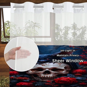 Detail of gothic sheer shower curtain with skulls and roses featuring metal eyelets