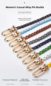 Detail view of woven leather texture and polished gold alloy buckles in eight colors