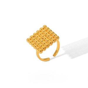 Macro shot of 18K gold plated stainless steel ring with square beaded face detail