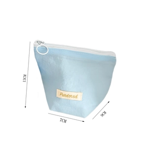Detail view of sky blue storage bag with dimensions 13x7x9cm and round zipper puller