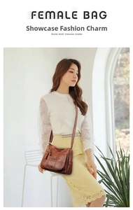 Detail of brown litchi pattern leather crossbody bag with kangaroo logo and zippers