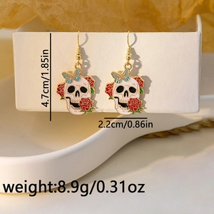 Detailed dimensions of skull earrings with red roses and blue butterflies on a white box