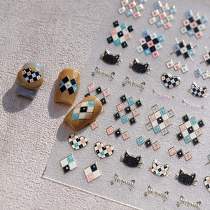 Nail art stickers with cat heart patterns and glitter finish on three display nails