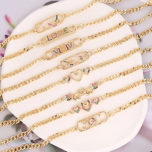Gold chain bracelets with star and colorful heart pendants featuring cubic zirconia stones