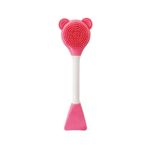 Detail of pink silicone bear face cleanser with dual-ended brush and spatula applicator
