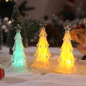 Mini LED acrylic Christmas tree lights with warm glowing fiber optics on artificial snow