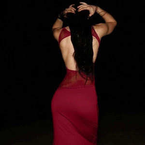 Detailed back view of a sexy red backless lace maxi dress with hollow out design features