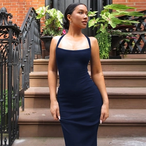 Close-up of navy blue halter neck bodycon midi dress showing premium fabric and slim fit