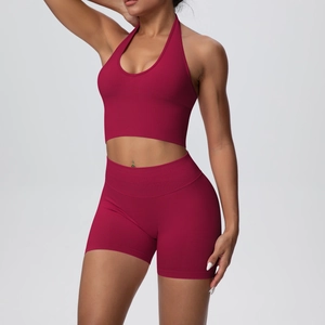 Close-up of wine red ribbed knit yoga set featuring high-waisted shorts and halter top