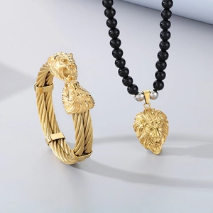 Set of gold lion head torque bangle and 8mm black onyx beaded necklace set