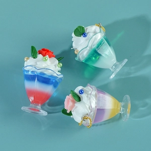 Three gradient ice cream sundae charms with cream and rose details on gold chains